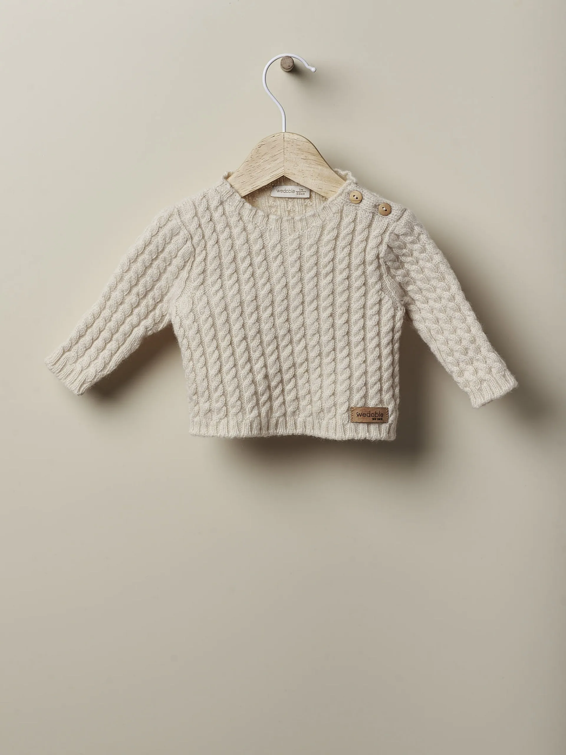 Maglione a maniche lunghe lavorato a trecce