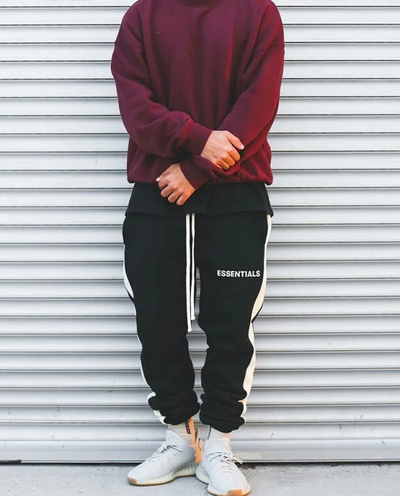 Pantaloni sportivi da uomo a contrasto di colore con cinturino alla caviglia con coulisse